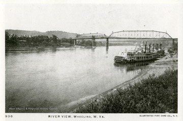 A picture postcard of boats on the Ohio River in Wheeling, West Virginia.