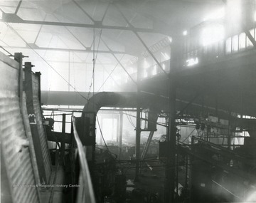 Smoke fills the interior of the Glass Plant in Star City, near Morgantown, W. Va. 
