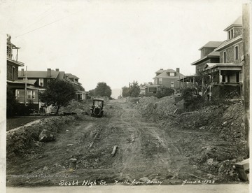 South High Street, North from Dorsey, in Morgantown, West Virginia. Houses under construction and the road is unpaved. 