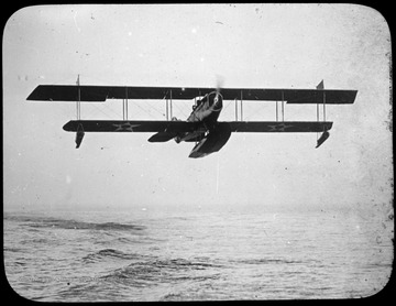 World War I Lantern Slide Show. Slide No. 52 in group of originally numbered slides.  American seaplane taking off.  Frame is labelled with text saying 'Visual Bureau, University of Pittsburgh.'  (negative no. 52-2930 is inscribed on slide)<br /><br />