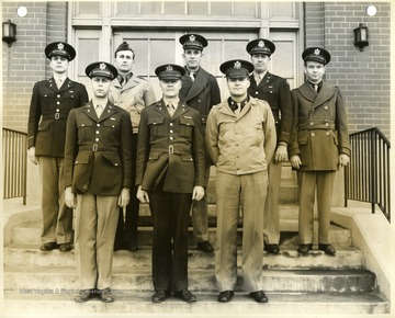 'Front row, left to right -- Major Emil F. Werly, Major Donald L. Sibray, Major E. A. Brinkman.  Back row, left to right -- Capt. Thos. F. Gibbs, Capt. M. J. Barnett, Capt. Vern O. Whitman, Capt. Walter Greig, 1st Lt. W. A. Catlett.'