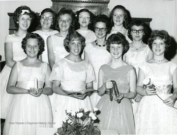 'Sue Seranella (Childs), front right; Mary Brown, second from left in second row.  Possibly Senior Girl Scouts.'