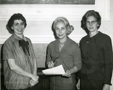 "Campus Club members Mrs. C. Mahlon Fraley, center; Mrs. Alan Gilbert, left; and Mrs. J. J. Lawless, president of Campus Club.