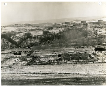 '3:00 P.M. March 17, 1941.  Taken from tower No. 1, Looking East, Foundation work on factory building.'