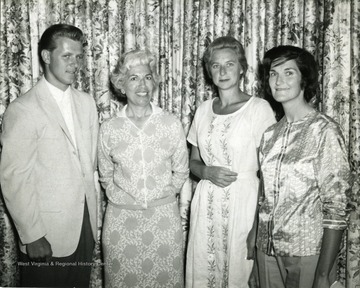 Attending are as follows left to right: 'Frank Sluviak, club pro; Mrs. Anthony Datillo, guest; Mrs. Jack C. Morgan, winner; and Mrs. Melvin Rexroad, Jr., chairman of women's golf activities at club.'  