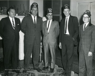 Members of the Shriners Club. Some of the Shriners include: 'Wallace Reed, C. Gregory VanCamp, Richard E. Davies' others in the picture are unknown. 