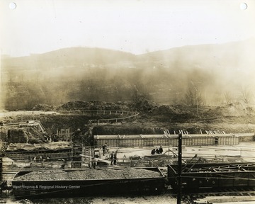 'Morgantown Ordnance Works, Morgantown, W. Va. Photograph Number 107. Coke oven area-base for coke ovens in right foreground. Framework for flue and stack base on left. Looking East. February 13, 1941, 11:00 A.M.'