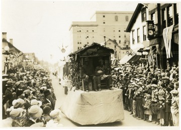 Two African Americans on a float in the parade.