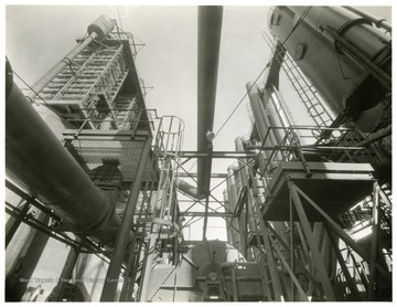 Aeration Towers, Building 161 and Secondary Scrubbers, Building 127.  Secondary Gas Booster, Building 128, in foreground.  View looking North.  From Volume One of Morgantown Ordnance Plant Pictures at Morgantown, W. Va. Constructed and Operated by the Ammonia Department, E. I. Dupont De Nemours and Company.