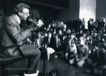 'Don Knotts regales a youthful audience with tales from intrigue and mystery during a special visit to West Virginia University in the 1970s. Knotts, who worked for WVU when he was a student here in the 1940s, has returned many times to give back to his alma mater.