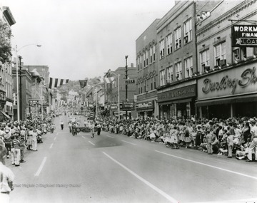 'The 1958 Labor Day parade is enacted in a loacale very similar to that of today. The tenants may be different, but the buildings have changed very little.'