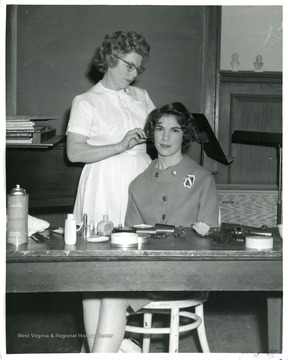 Patty Watson is getting her hair done at a Hairdresser's Shop.