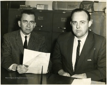 Man on left is 'Dr. Charles W. Cox'. 