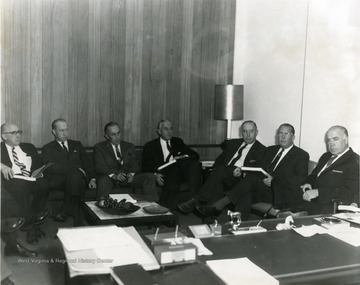 From Left to Right: 'Mayor Arthur Buehler', Unknown, Unknown, 'Robert T. Donley', 'Harold Fetty', 'J. W. Ruby', and 'Dyke Raese'. 