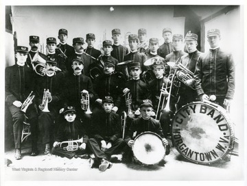 Members of the Morgantown City Band of Morgantown, West Virginia pose for a group portrait with their instruments.