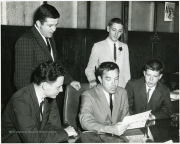 Standing (Left to Right) Chuck Haden and Bill Kennel.  Seated (Left to Right) William Davis, Stan Cox, John Blosser. 
