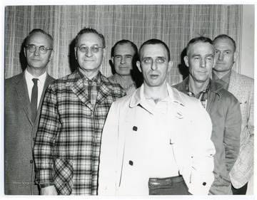 Group portrait of six men.