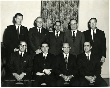 Second from left, standing 'has Nehi Bottling; third from left, standing, Professor of Education, Wagner; Front row, far right, Foster Mullenax.'