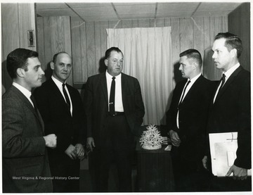 'From left to right: unknown, Robert Nestor, Bill Hancock, unknown, Burkey Lilly.'