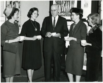 Assistant Superintendent of Schools, Z. A. Clark, is flanked by four women.