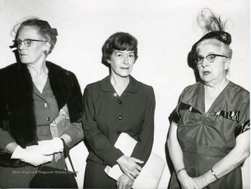 'Left to right: Unknown, Agnes Smith, and Mrs. Nell Leonian'. 