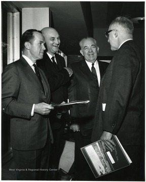 Second from the left is Ernest V. Nesius.  On the far right is John Sherlacher.