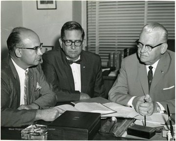 Unknown man with Senator Moreland and Clarence Johnson.