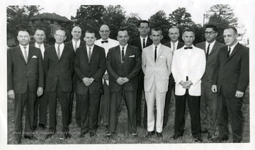'LUTC Graduates-Graduates of the Life Underwriters' Training Council class are shown after completing the eight-month course at Fairmont State College. The local men were among 1,200 in the United States who completed the course. From left are H.F. Bondy, Hartzel Jones, LUTC chairman; D.E. Daniel, Noel Nuzum, R. H. Funk, Bernard Stalder, Robert Fancher, Ray Van Gilder, Al Hess, Orville Postlewait, assistant instructor; Russell I. Callett, John L. Romeo, instructor, and Raymond McVicker. Not shown are R.W. Field and F.W. Sanders of Kingwood.'