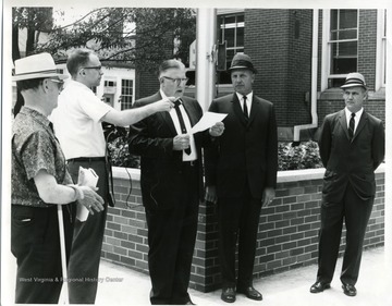 Right to left: Robert Nestor, Charles Whiston, Charles A. Stevenson (speaker,) Jack Johns, and Earl Fisher