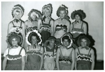 Group of boys wearing sundresses and bonnets.  'Front row, left to right:  Cecil Smyth, Terry Gatian, Larry Gatian, Ivan Sumpter, and Lonas Maxwell.  Back row, left to right:  Sonny Bowers, Jim Crislip, Phil Colebank, Roy Denjen, and Roger Willard.'