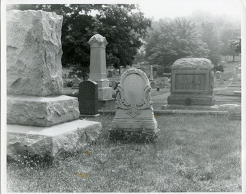 A close-up view of several graves and tombstones, including Morgan, at the Oak Grove Cemetery in Morgantown, West Virginia.