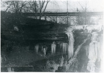 'The frozen waters of Falling Run, where the stadium now stands, are shown in this early photograph taken during the winter of 1919. The present stadium bridge can be seen in the background.'