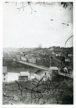 A view of Morgantown, West Virginia. 'The courthouse is shown with two stories-this may date the photo, pre-1868, post 1851. I believe that this print is reversed-note position of Morgantown Academy.'