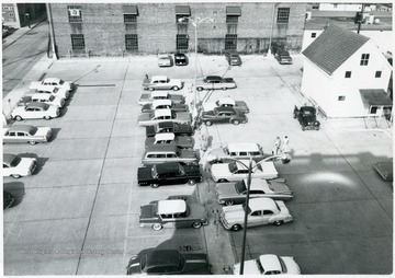 View of cars parked in the parking lot between High and Chestnut St. Morgantown, W. va.