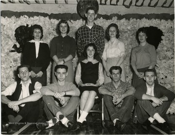 "Valley High School's Sweetheart Dance, to be from 8-11 p.m. tonight, will be royally ruled by Valley's 1961 Sweetheart, Christie McMillen, seated, and her court. Boys seated, left to right, are Butch Richardson, John Rehe, Vic Provenson and Sonny Pierce. Girls are Linda DuPont, Mary Ann Holipski, Yvonne Dawson and Barbara Lipscomb. Miss McMillen's escort, Jim Ord, is standing behind her. Admission to the dance is 35 cents."