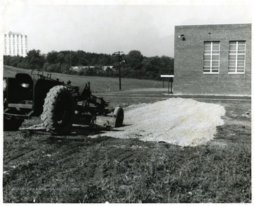 View of tractor parked in the unpaved area next to St. Francis High School in Morgantown, W. Va.