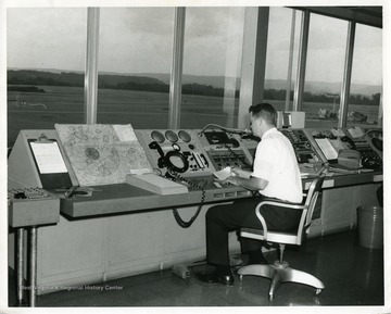 An airport employee is working at the FAA Control Station at the Morgantown, West Virginia, Morgantown, West