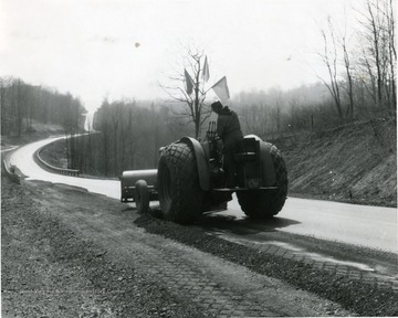 A tractor driving down Hartman Run Road looking southeast.