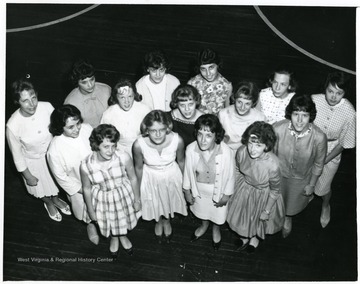 View of members of the M.H.S. club Morgantown W. Va. from above. Members include, second row, Teresa Liberatore, Cathy Curry, Brenda Hood; third row, Carolyn Peluso, Emilene Palmer.