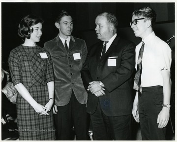 Left to right:  Ralph Squires, President Harlow, Marshall Orellion, and Judy Childs.