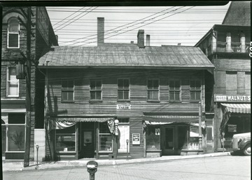 Early Frame building on Walnut Street between Dering Funeral Parlor and the Bergman building.