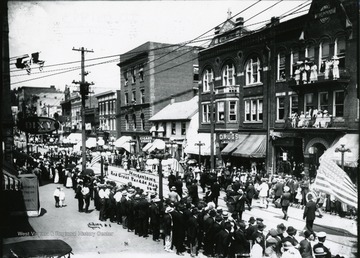 Participants are marching in the Red Cross Parade in Morgantown, West Virginia.