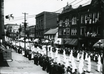 Participants are marching in the Red Cross Parade in Morgantown, West Virginia. 