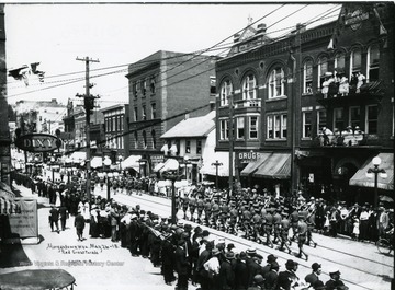 Onlookers watch marchers in the Red Cross Parade on High Street in Morgantown, West Virginia. 