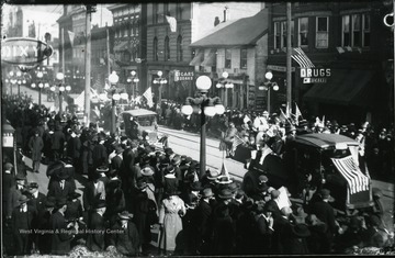 People gather to see the Armistice Day Parade on High Street.