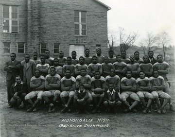 Group portrait of the Monongalia High School in Westover football team.  Monongalia High was a school for African-American students in Mon county.
