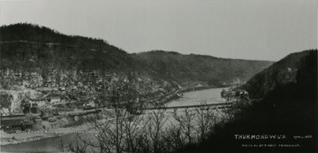 A view of houses alongside a hill overlooking the New River in Thurmond, West Virginia. Photo by R. E. Ribble, Prince, West Virginia.