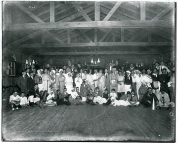 Campers gather dressed in costume for a group photo.