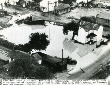 View of 'W6-6/19- Petersburg, W. Va.: Aerial view shows Petersburg, W. Va. Community hardest hit by floods which harrassed the Shenandoah and Potomac Valleys. Nine Died, scores missing, and thousands were left homeless. (ACME TELEPHOTO)' 'Acme Newspictures, Division of NEA Service Inc., 1257 South Los Angeles St., Los Angeles, Calif.'