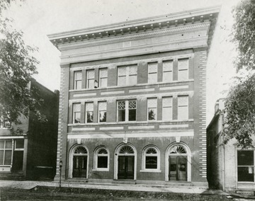 View of the Hardy County Bank Building in Moorefield, West Virginia. It was Built in 1910, the bank started in Wilson's Store Building at the left, and the bank was closed in the depression of 1930, and sold in 1932.